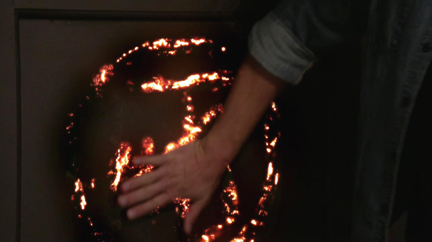 Dean cuts his own hand and activates the sigil. Dean cuts his own hand and activates the sigil.